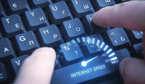 Male hands typing in keyboard Speedometer Internet speed